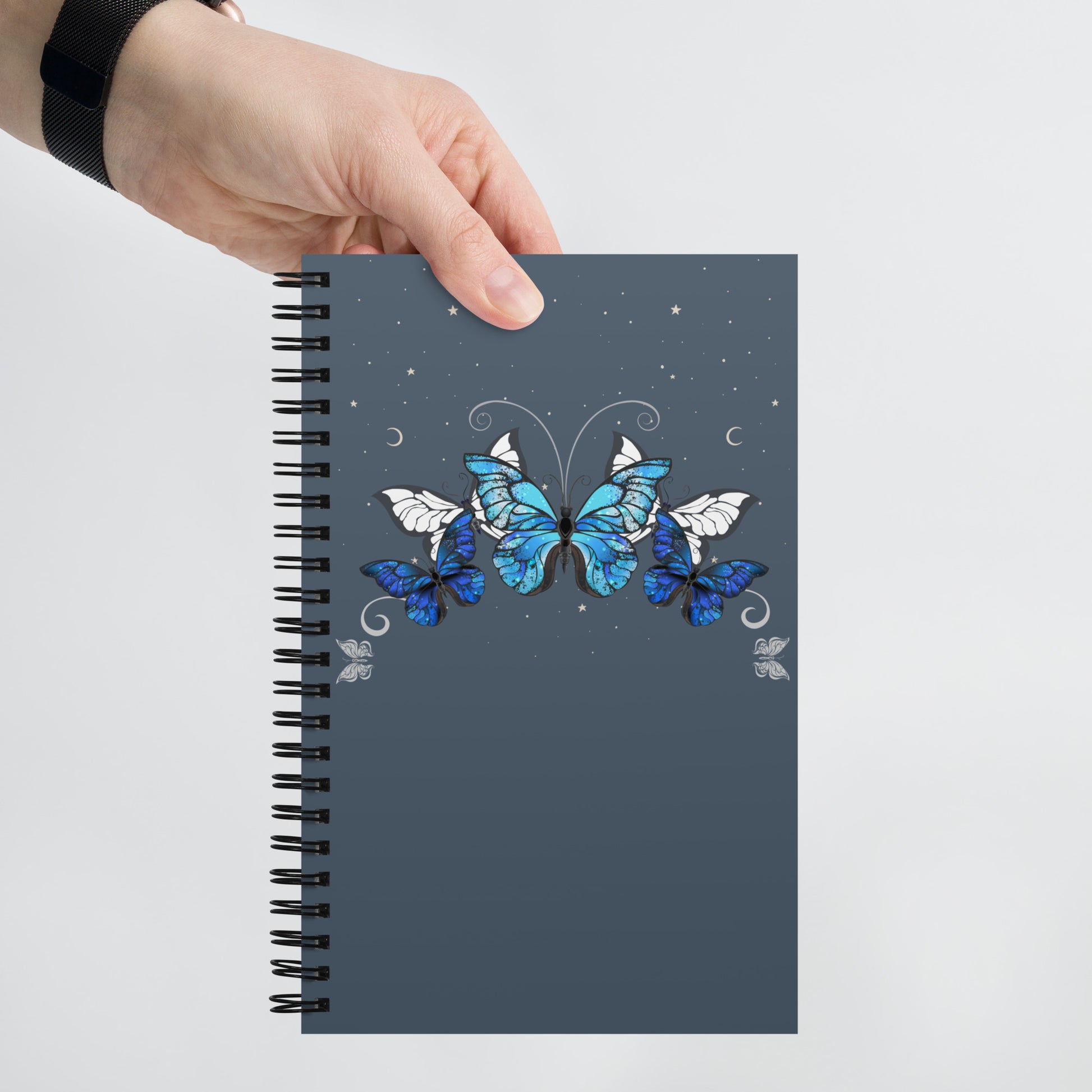 Blue Butterflies spiral-notebook-white-front-in hand